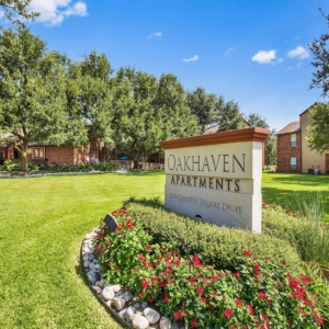 Oakhaven Apartments Main Sign with Leasing office in the background