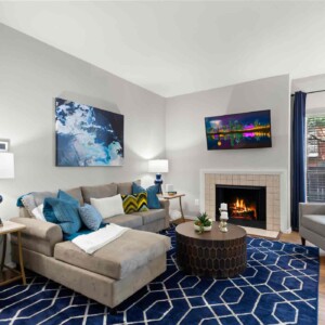 Living area with glowing fireplace